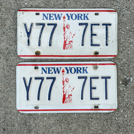 Photo of a 1986 New York License Plate Pair Auto Tag Garage Decor Vintage Lucky 7 Repeat Repeating Y 777 ET with original patina