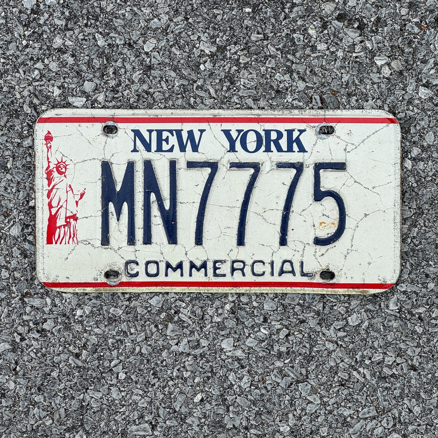 Photo of a 1986 New York Truck License Plate Auto Tag 1 Garage Decor Liberty Base 777 MN7775