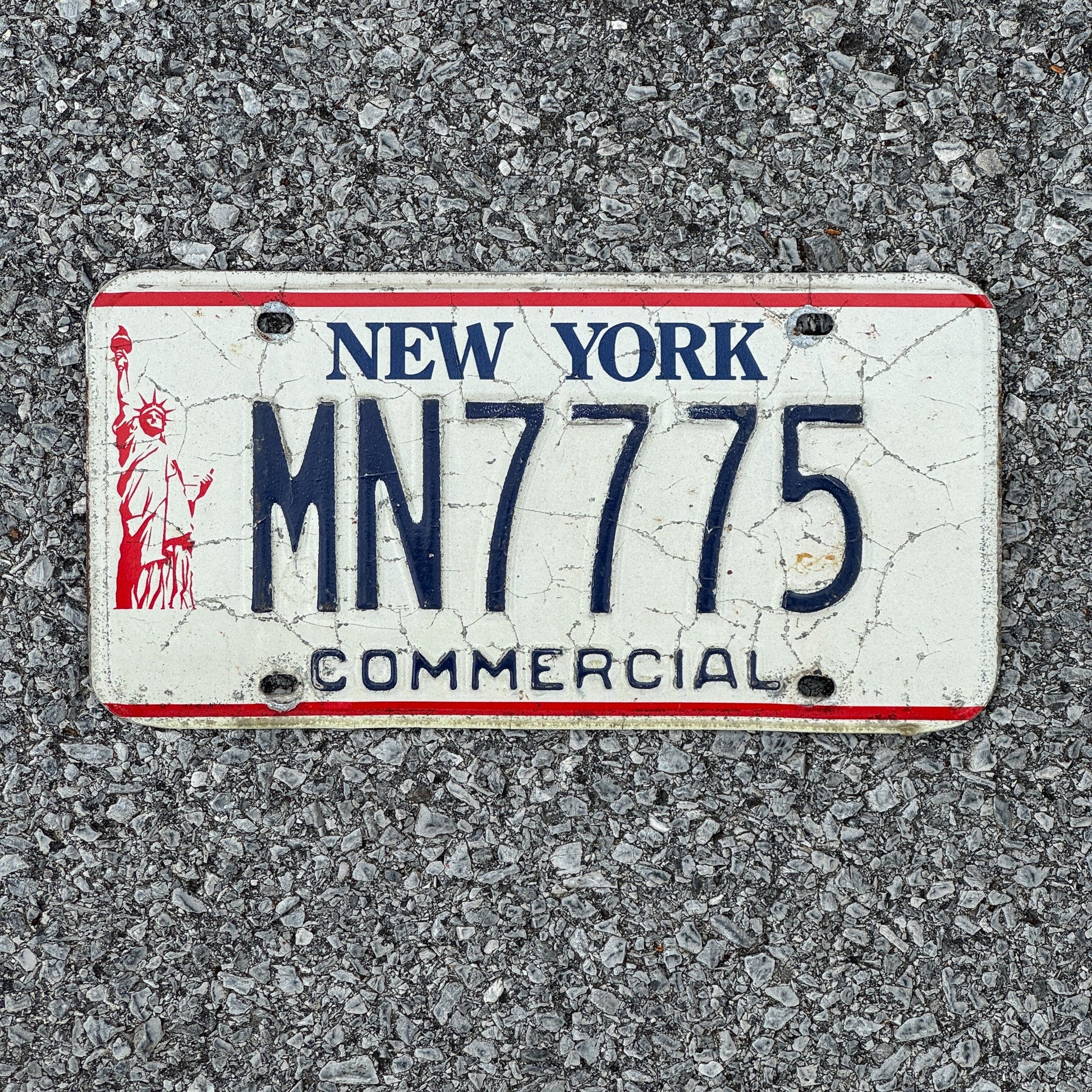 Photo of a 1986 New York Truck License Plate Auto Tag 1 Garage Decor Liberty Base 777 MN7775