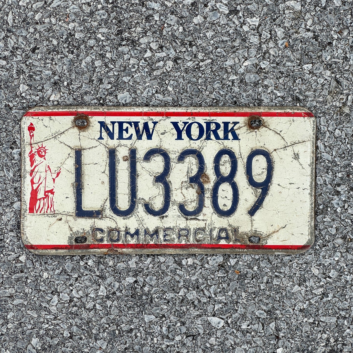 Photo of a 1986 New York Truck License Plate Auto Tag 2 Garage Decor Liberty Base LU3389
