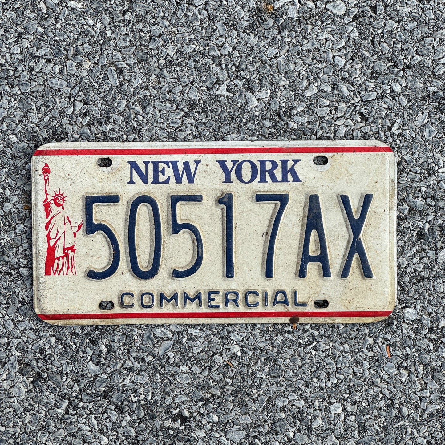 Photo of a 1986 New York Truck License Plate Auto Tag Garage Decor Vintage Liberty Base 50517AX