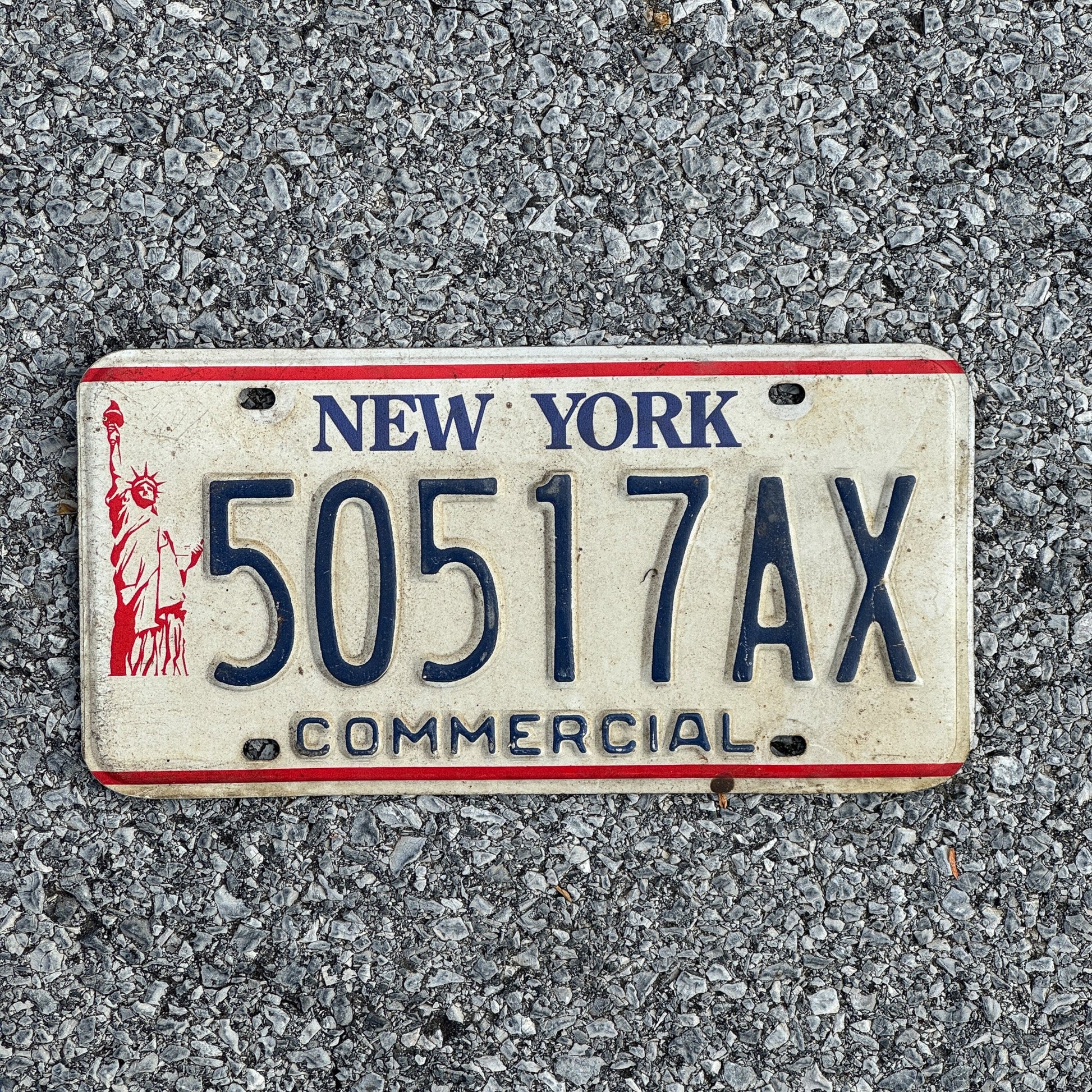 Photo of a 1986 New York Truck License Plate Auto Tag Garage Decor Vintage Liberty Base 50517AX
