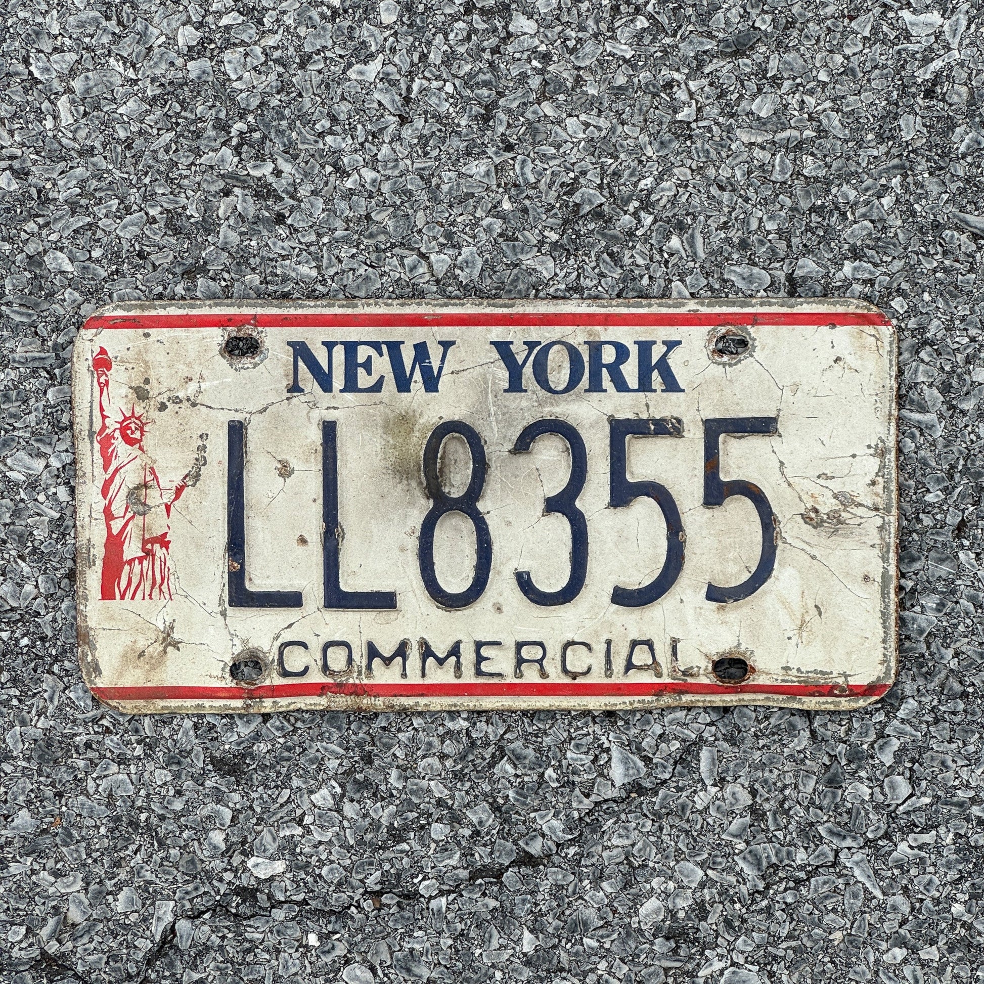 Photo of a 1986 New York Truck License Plate Auto Tag Garage Decor Vintage Liberty Base LL8355