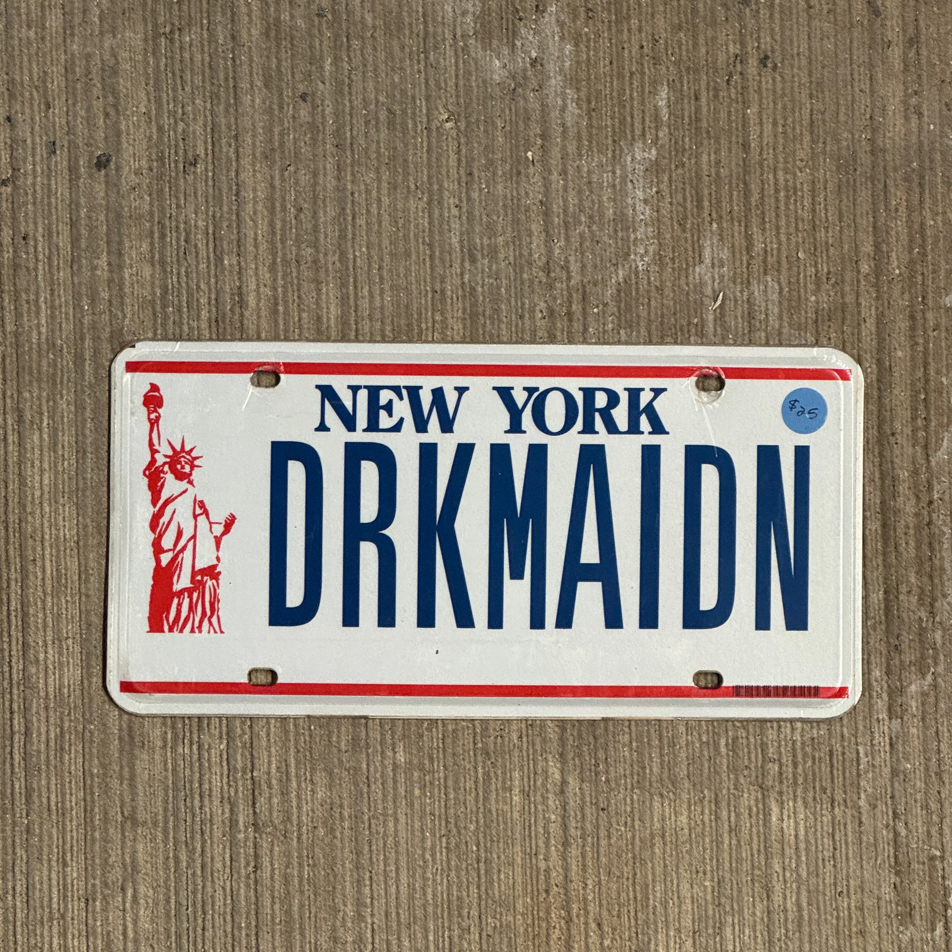 Photo of a 1986 New York Vanity License Plate Auto Tag 1 Vintage Garage Dark Maiden DRKMAIDN with original patina