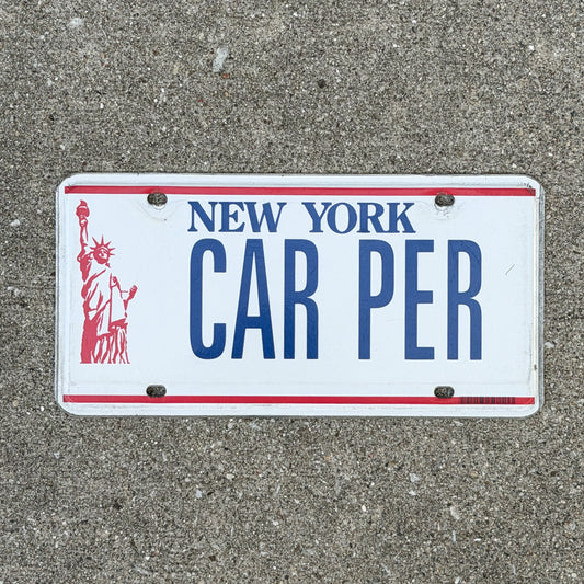 Photo of a 1986 New York Vanity License Plate Auto Tag Garage Decor Vintage Liberty Base CAR PER with original patina