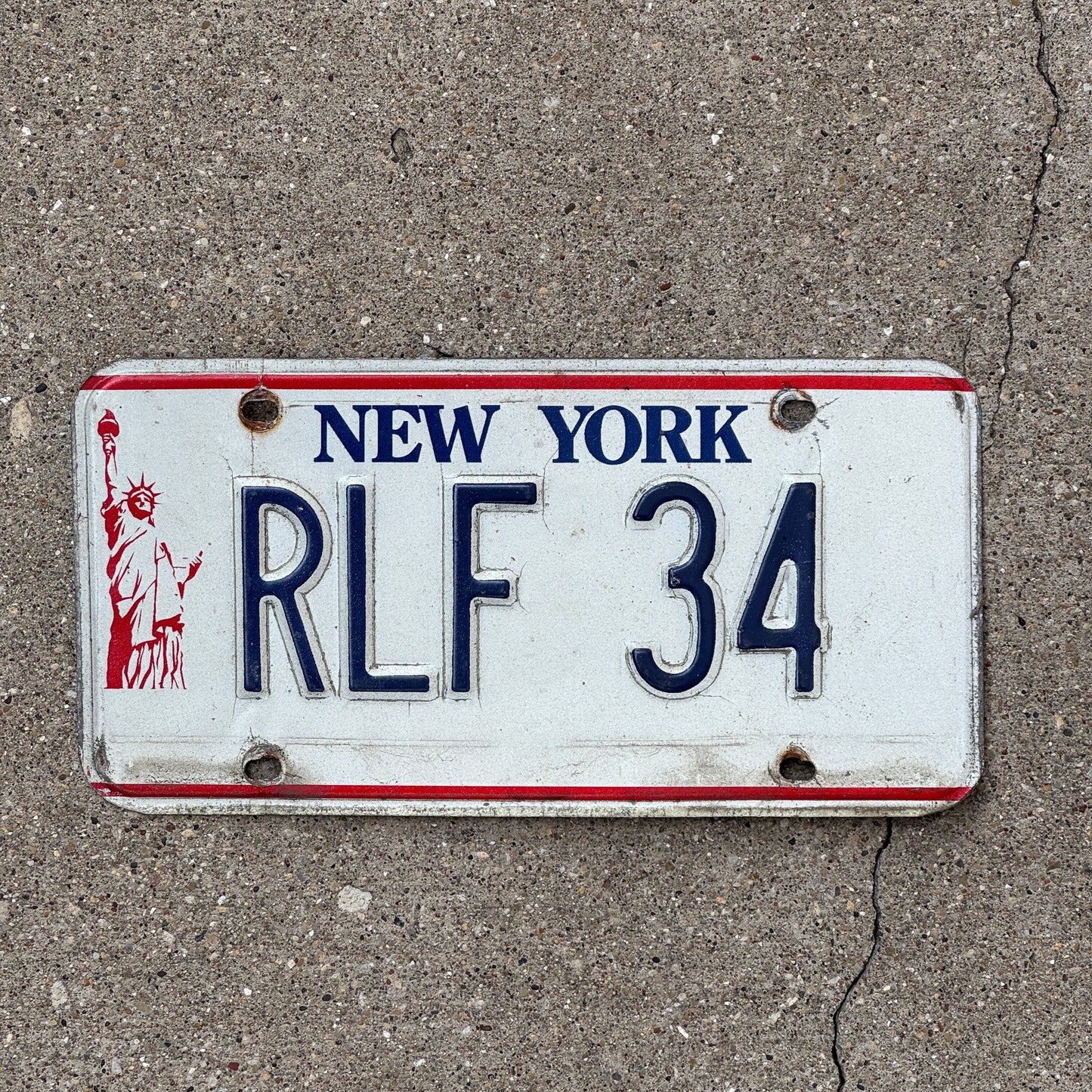 Photo of a 1986 New York VANITY License Plate Auto Tag Garage Decor Vintage Liberty Tag 1 RLF 34