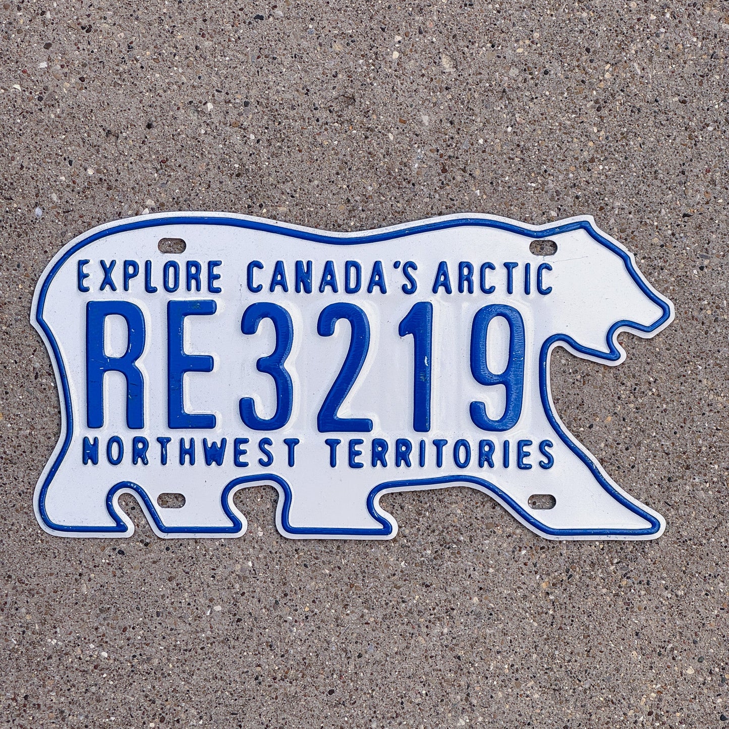 Photo of a 1986 Northwest Territories Rental License Plate Auto Tag Garage Decor Vintage Polar Bear RE 3219