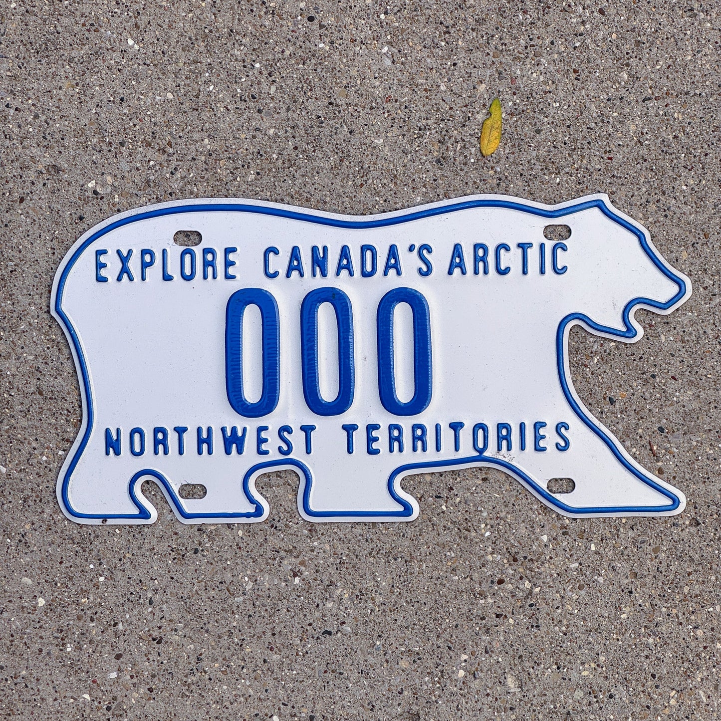 Photo of a 1986 Northwest Territories Sample License Plate Auto Tag Garage Decor Vintage Polar Bear 000