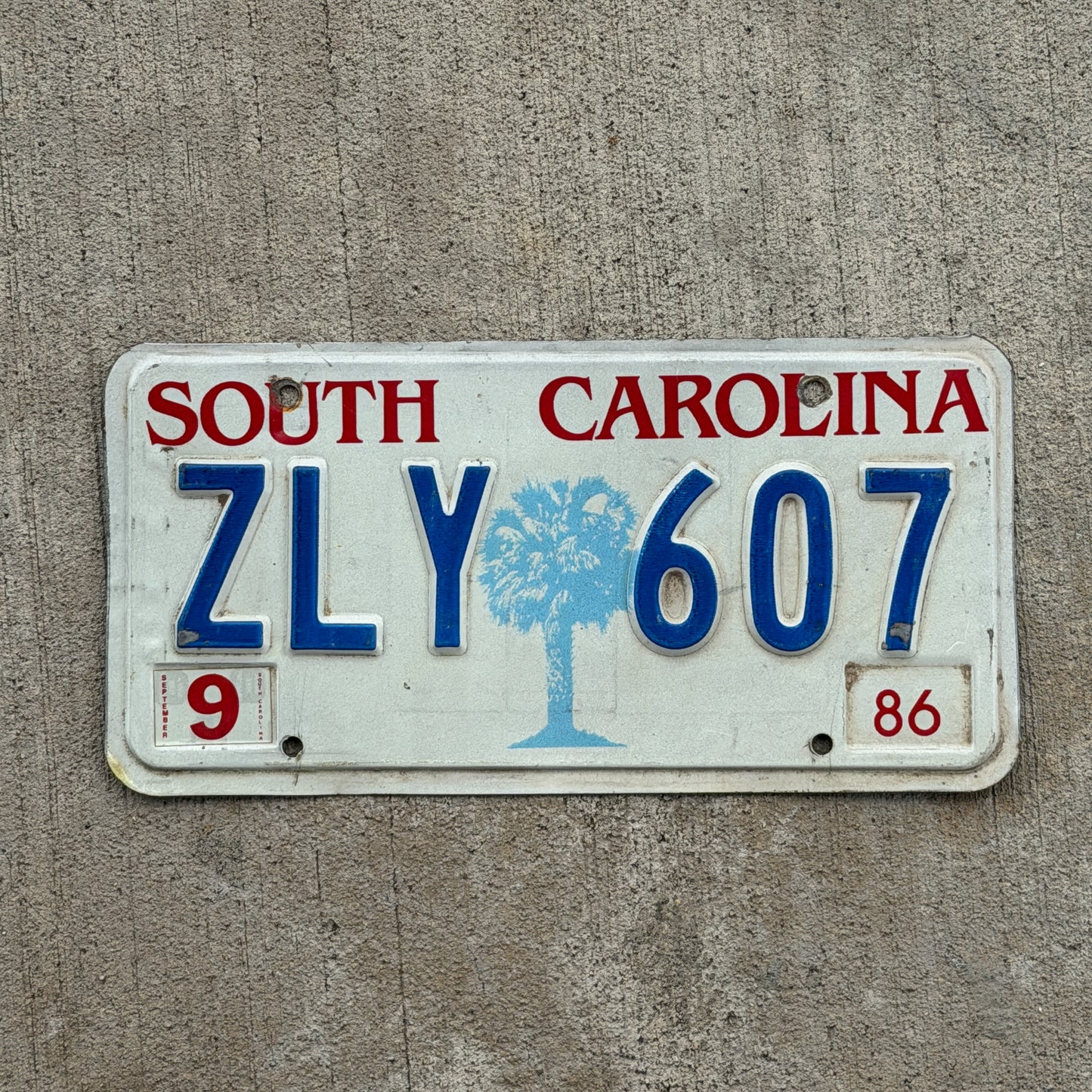 Photo of a 1986 South Carolina License Plate Auto Tag Garage Decor Vintage ZLY 607 with original patina