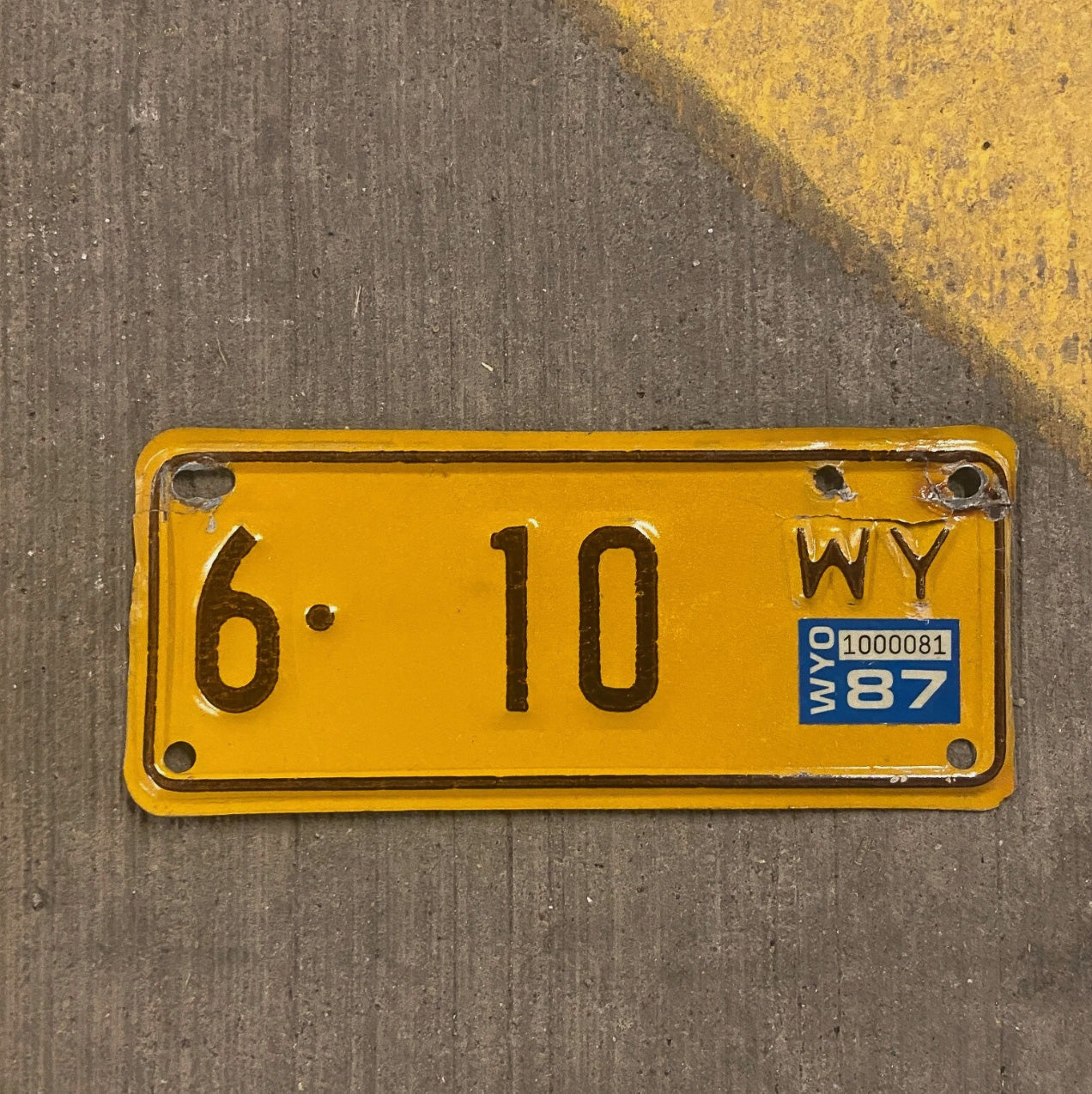 Photo of a 1987 1987 Wyoming Motorcycle License Plate Auto Tag Garage Decor Vintage Fremont County 6 Low Number Two Digit 6 10 with original patina