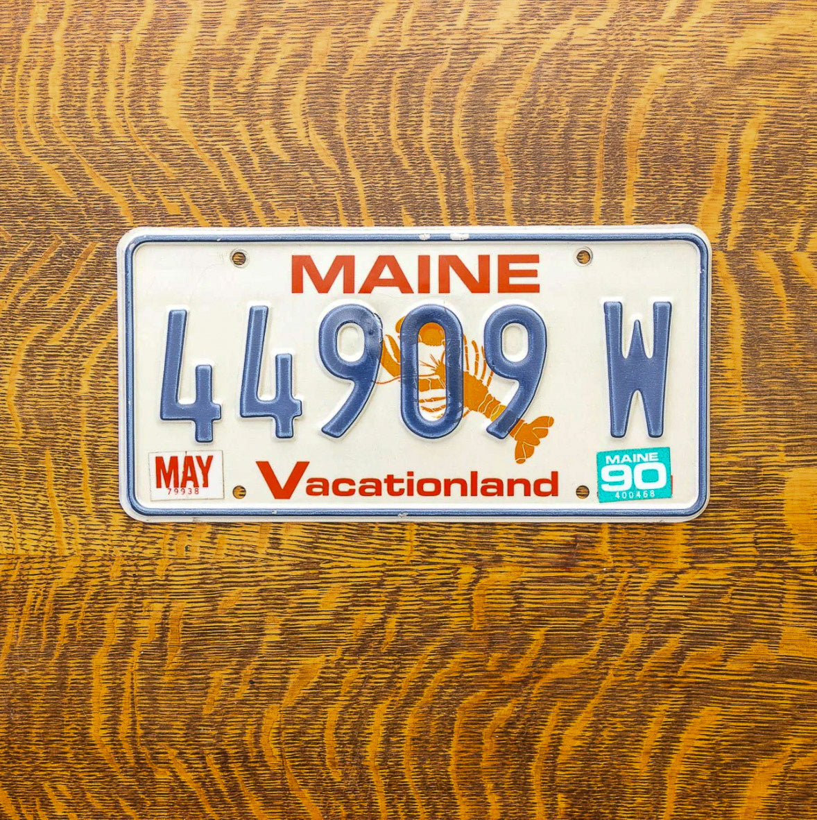 Photo of a 1987 1990 Maine License Plate Auto Tag Garage Decor Vintage Lobster Base 44909 W with original patina