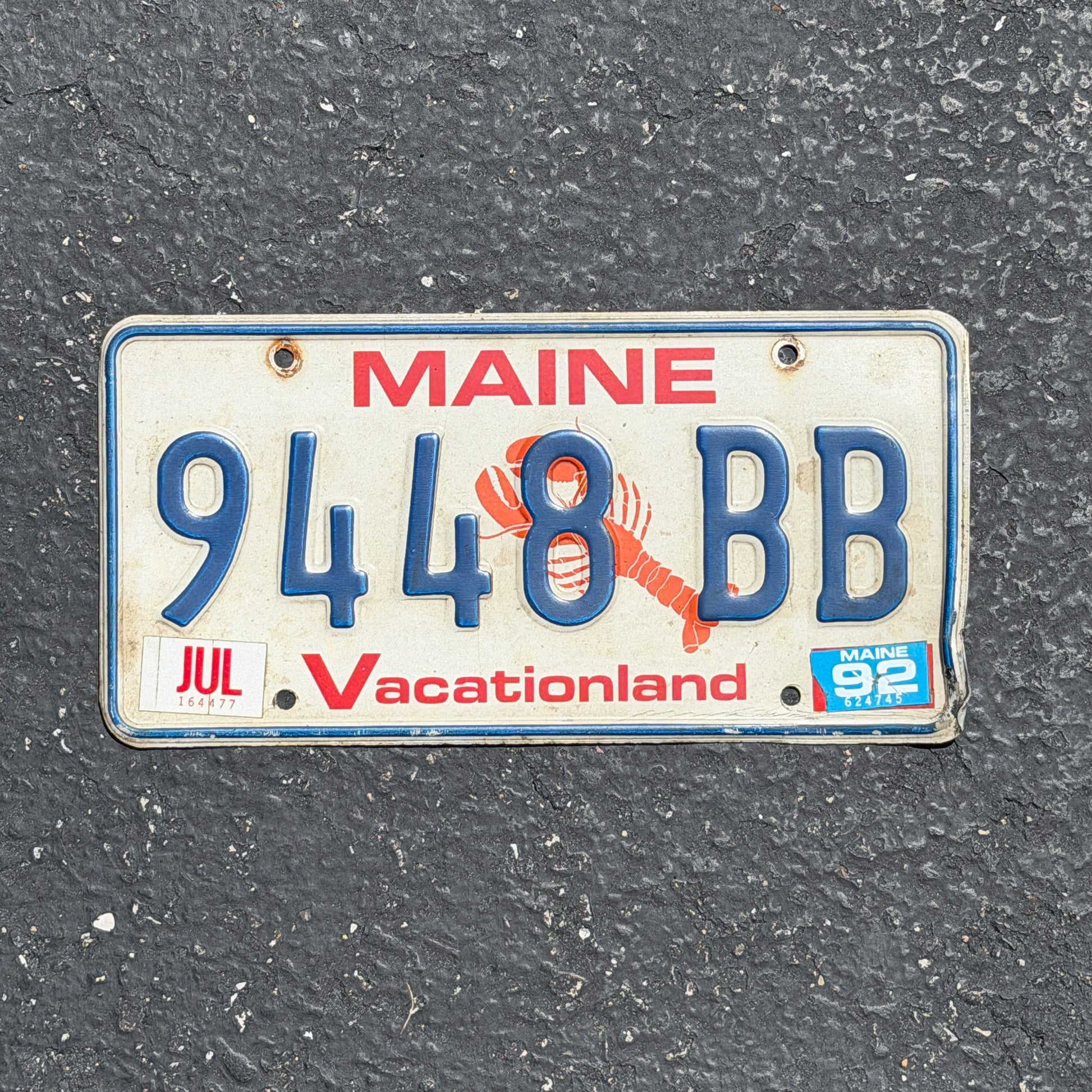 Photo of a 1987 1992 Maine License Plate Auto Tag Garage Decor Vintage Lobster 9448 BB with original patina