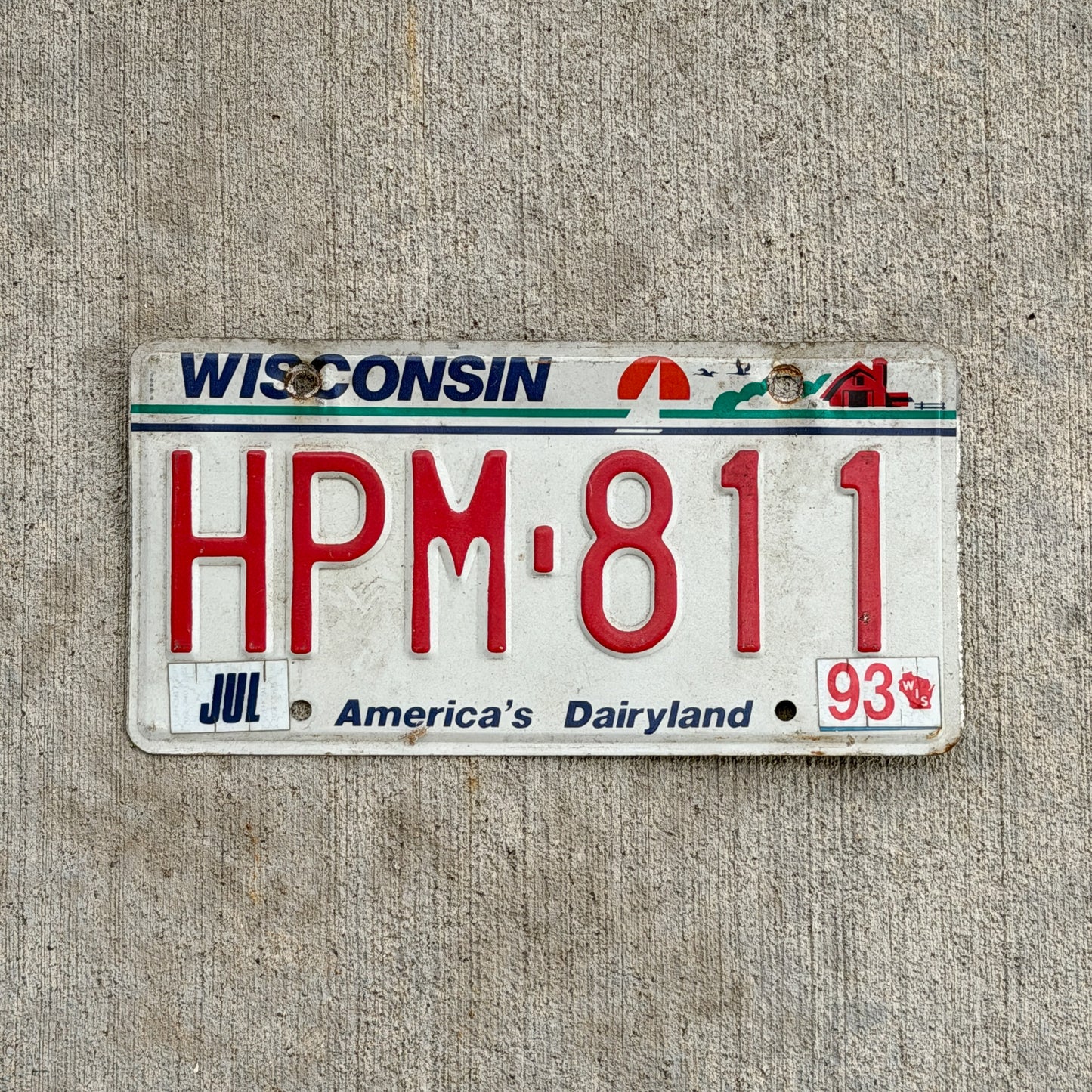 Photo of a 1987 1993 Wisconsin License Plate Auto Tag Garage Decor Vintage HPM 811 with original patina