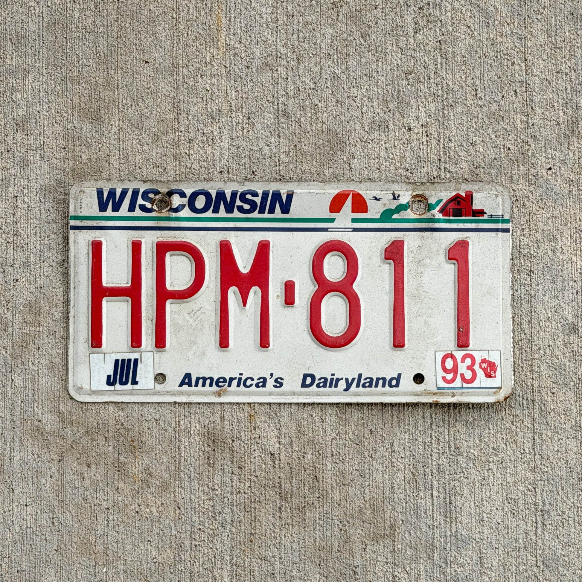 Photo of a 1987 1993 Wisconsin License Plate Auto Tag Garage Decor Vintage HPM 811 with original patina
