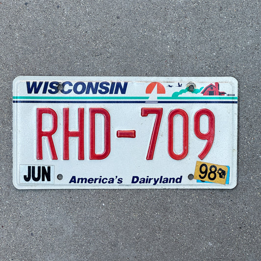 Photo of a 1987 1998 Wisconsin License Plate Auto Tag Garage Decor Vintage RHD 709 with original patina