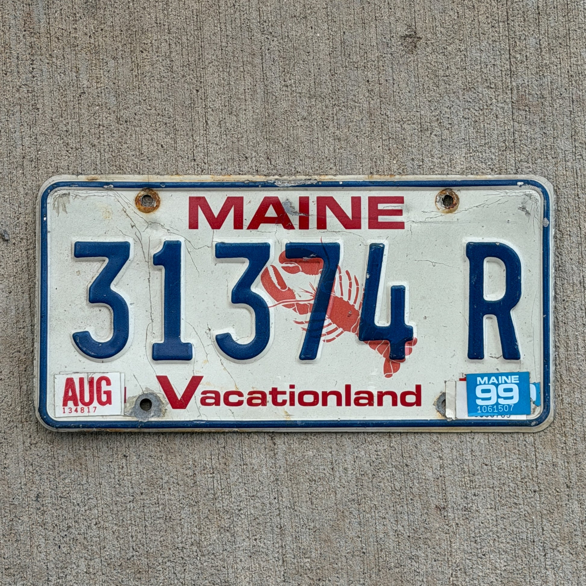 Photo of a 1987 1999 Maine License Plate Auto Tag Garage Decor Vintage Lobster 31374 R with original patina