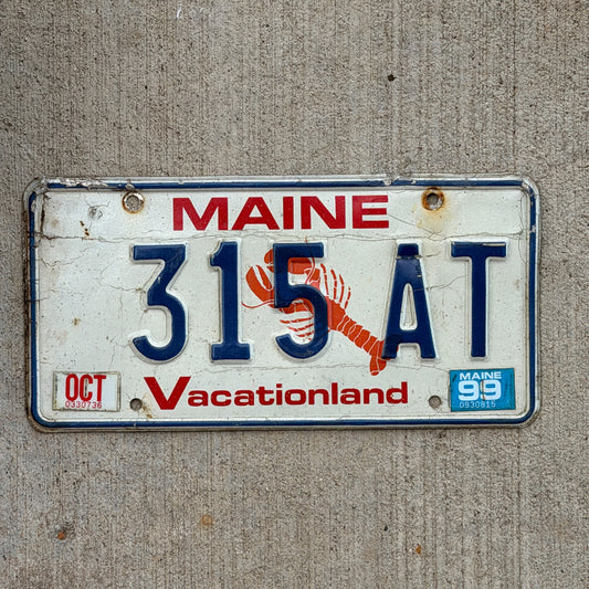 Photo of a 1987 1999 Maine License Plate Auto Tag Garage Decor Vintage Lobster 315 AT with original patina