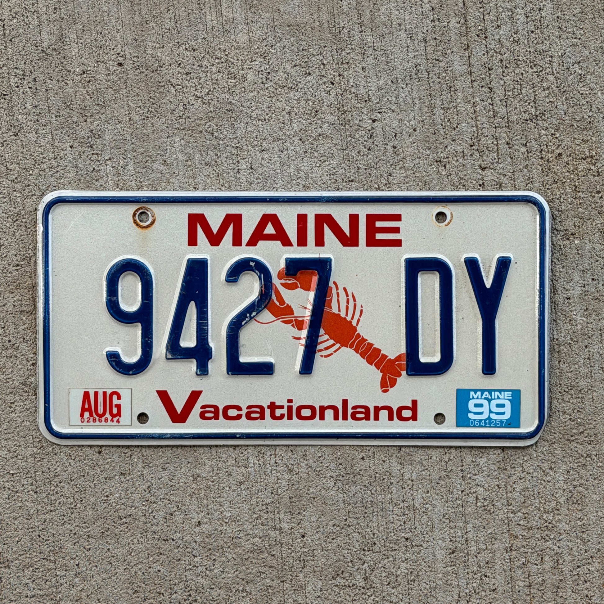 Photo of a 1987 1999 Maine License Plate Auto Tag Garage Decor Vintage Lobster 9427 DY with original patina