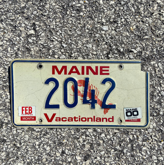 Photo of a 1987 2000 Maine License Plate Auto Tag Garage Decor Vintage Low Number Four Digit 2042 with original patina