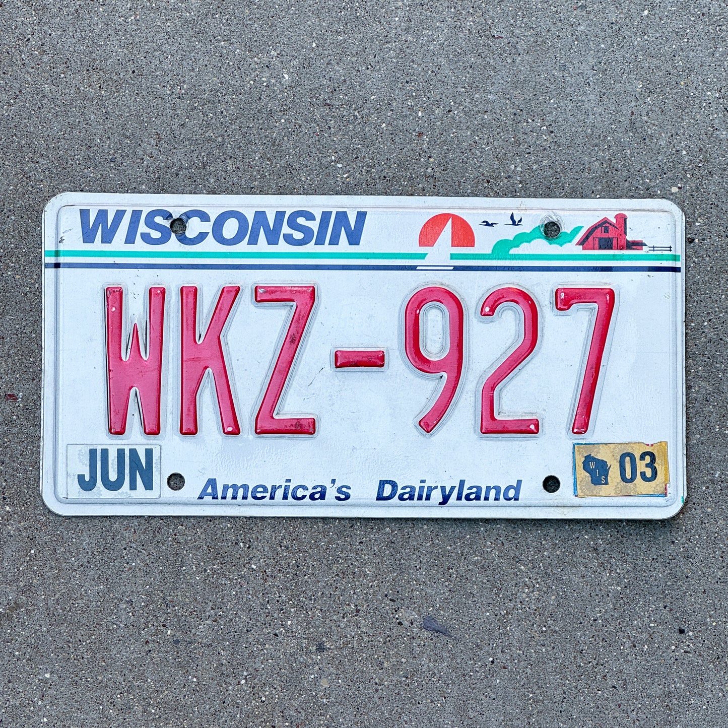 Photo of a 1987 2003 Wisconsin License Plate Auto Tag Garage Decor Vintage WKZ 927 with original patina