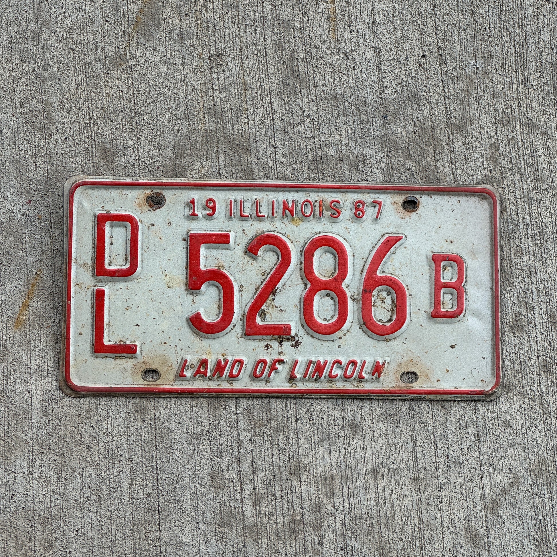 Photo of a 1987 Illinois Dealer License Plate Auto Tag 2 Vintage Garage 5286 B with original patina