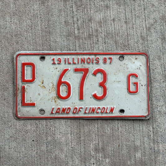 Photo of a 1987 Illinois Dealer License Plate Auto Tag 2 Vintage Garage Merritt's Sterling Ford Mercury Lincoln Dealer 673 G with original patina