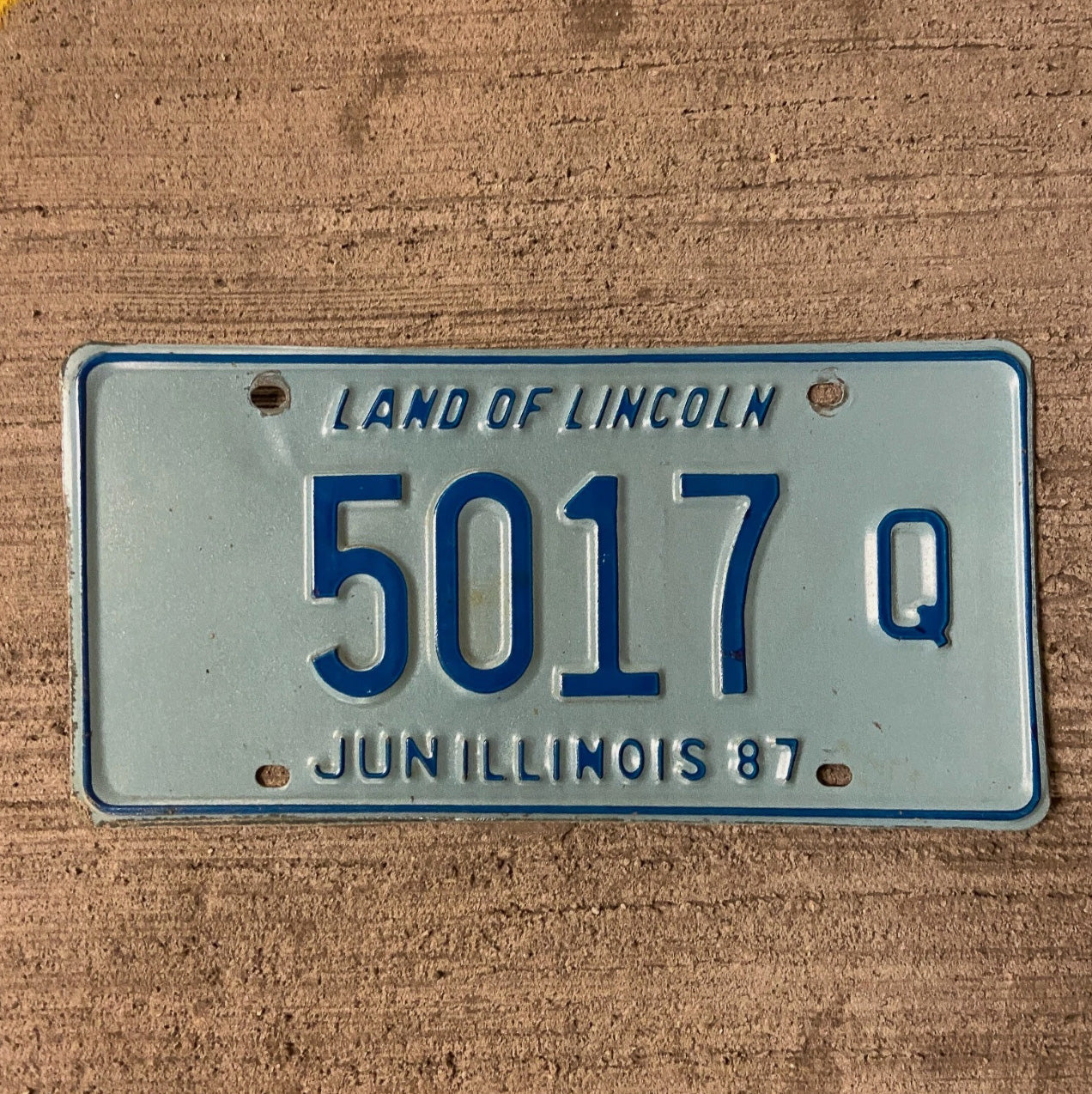 Photo of a 1987 Illinois Truck License Plate Auto Tag Garage Decor Vintage 5017 Q with original patina