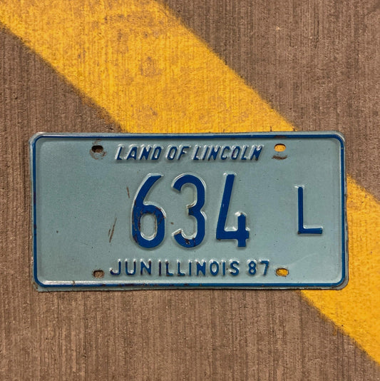 Photo of a 1987 Illinois Truck License Plate Auto Tag Garage Decor Vintage 634 L with original patina