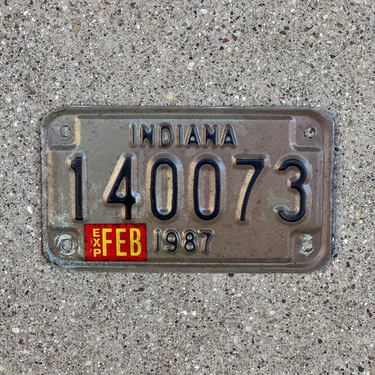 Photo of a 1987 Indiana Motorcycle License Plate Auto Tag Garage Decor Vintage 140073 with original patina