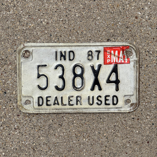 Photo of a 1987 Indiana Used Motorcycle Dealer License Plate Auto Tag Garage Decor Vintage 538 X 4 with original patina