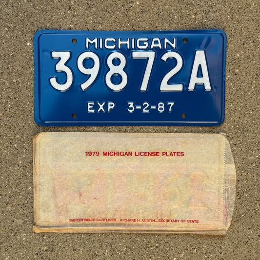 Photo of a 1987 Michigan Trailer 5 Year License Plate Auto Tag Garage Decor Vintage NOS with envelope (non-matching) 39872 A