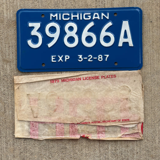 Photo of a 1987 Michigan Trailer 5 Year License Plate Auto Tag Garage Decor Vintage NOS with Original Mailing Envelope 39866 A