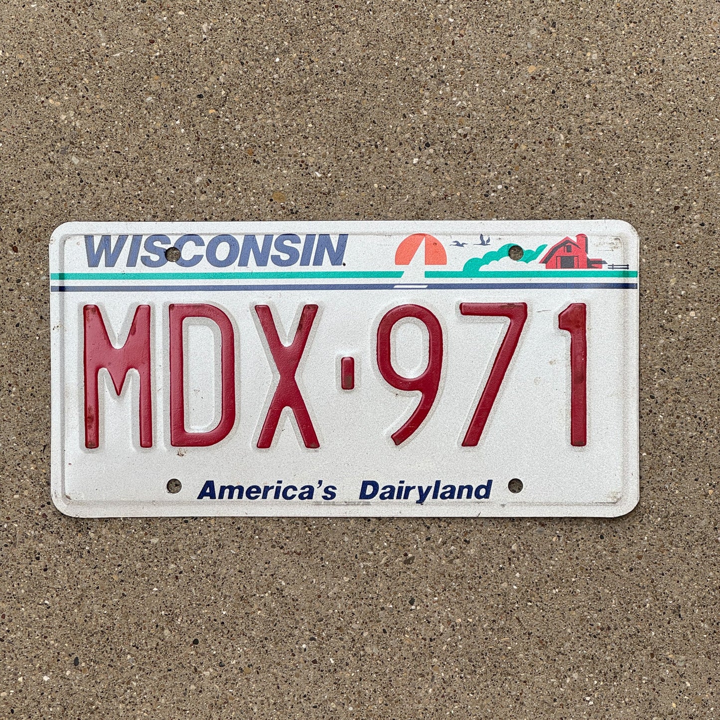 Photo of a 1987 Wisconsin License Plate Auto Tag Garage Decor Vintage MDX 971