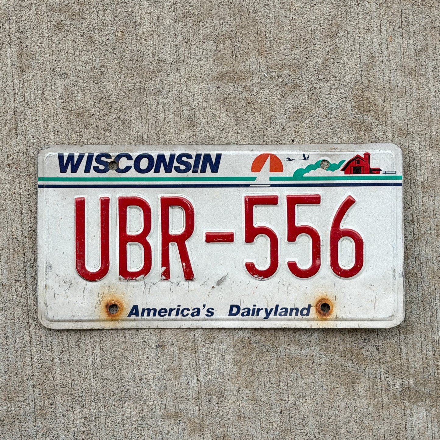 Photo of a 1987 Wisconsin License Plate Auto Tag Garage Decor Vintage UBR 556 with original patina