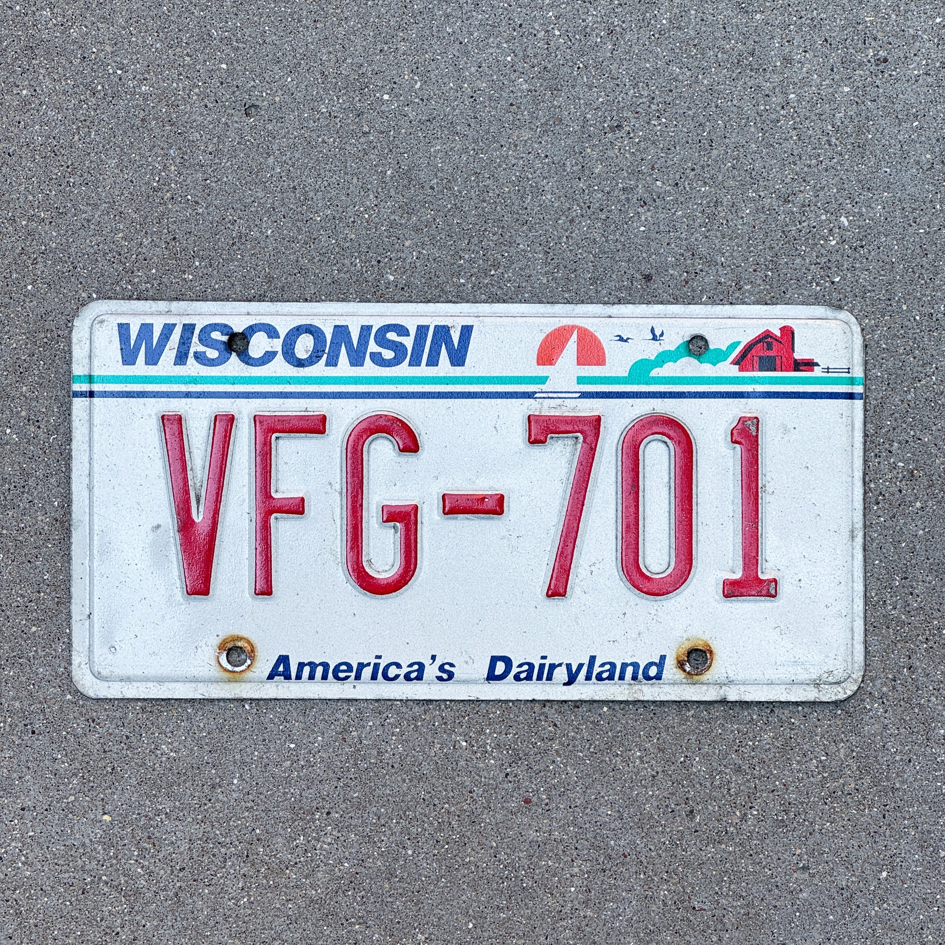 Photo of a 1987 Wisconsin License Plate Auto Tag Garage Decor Vintage VFG 701 with original patina
