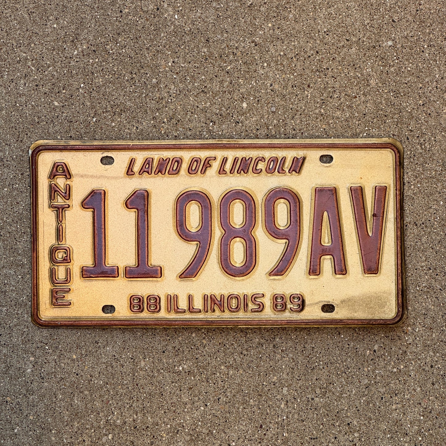 Photo of a 1988 1989 Illinois Antique Vehicle License Plate Auto Tag Garage Decor Vintage 11989 AV with original patina