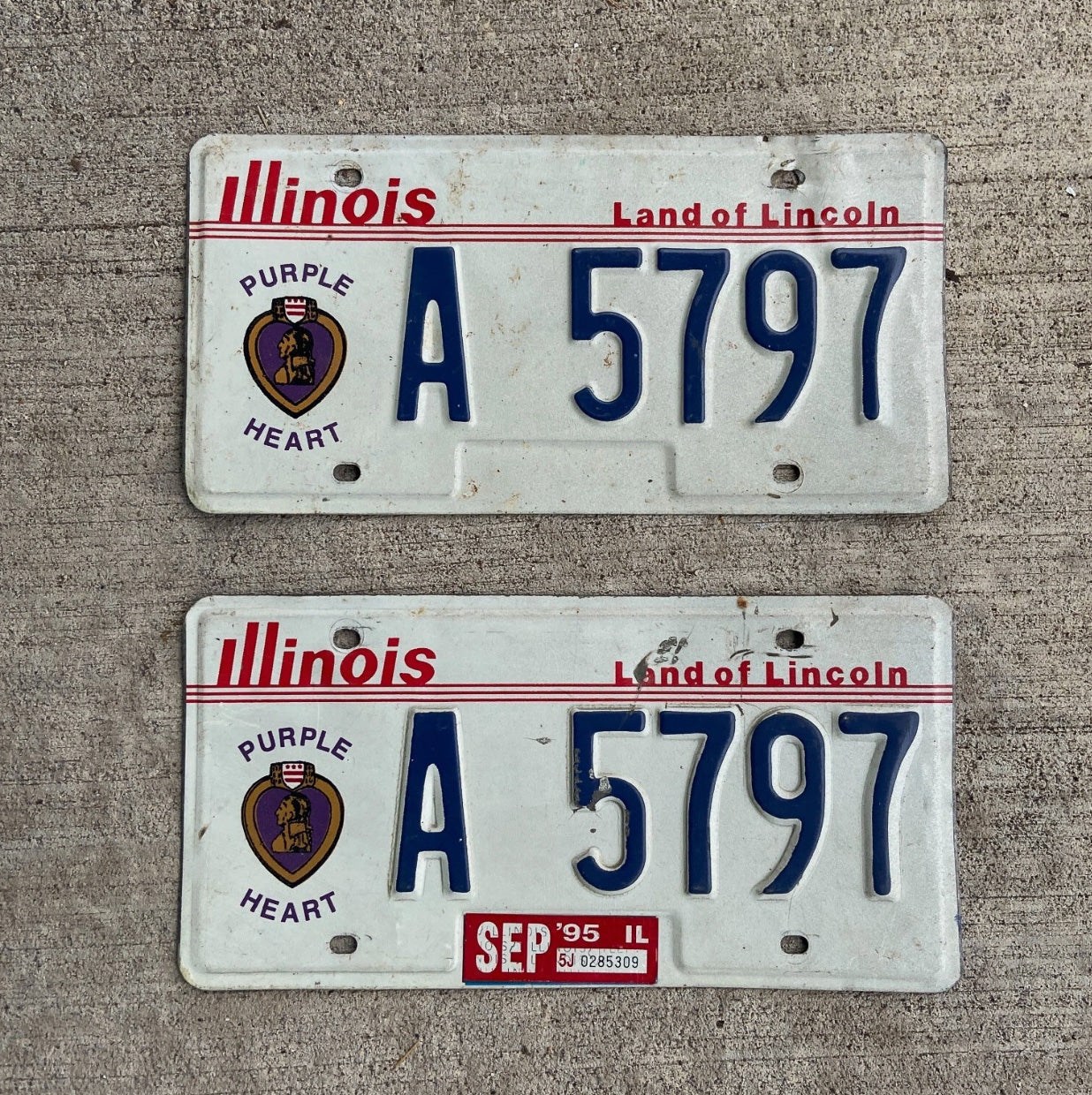 Photo of a 1988 1995 Illinois Purple Heart License Plate Pair Auto Tag Garage Decor Vintage Military A 5797 with original patina