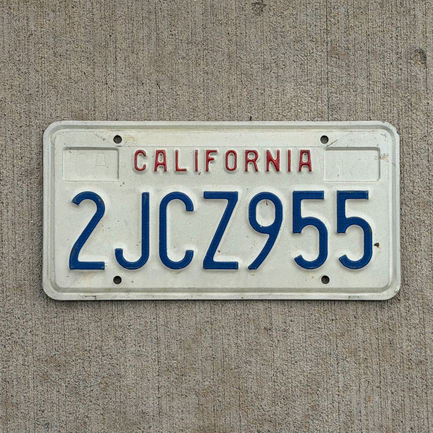 Photo of a 1988 California License Plate Auto Tag Garage Decor Vintage 2 JCZ 955 with original patina