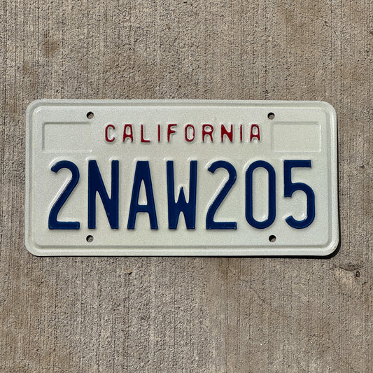 Photo of a 1988 California License Plate Auto Tag Garage Decor Vintage 2 NAW 205 with original patina