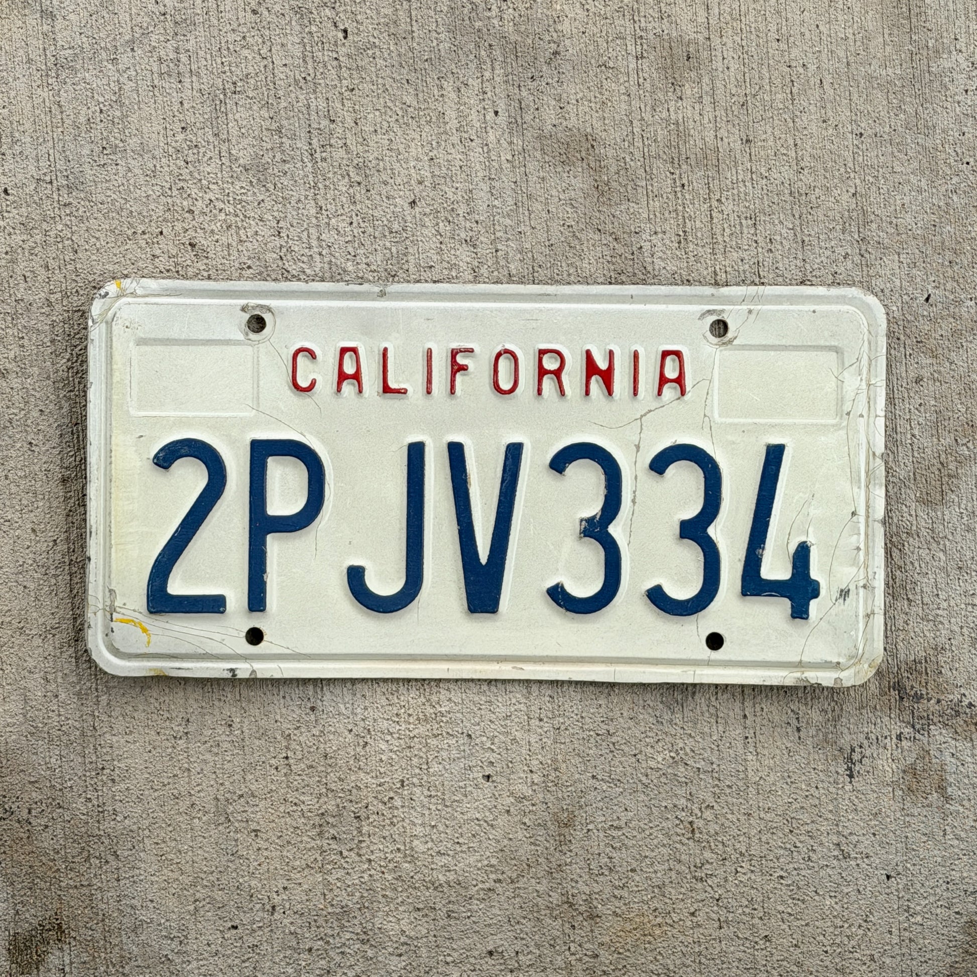 Photo of a 1988 California License Plate Auto Tag Garage Decor Vintage 2 PJV 334 with original patina