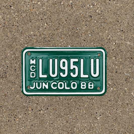Photo of a 1988 Colorado Motorcycle Dealer License Plate Auto Tag Garage Decor Vintage LU 95 LU