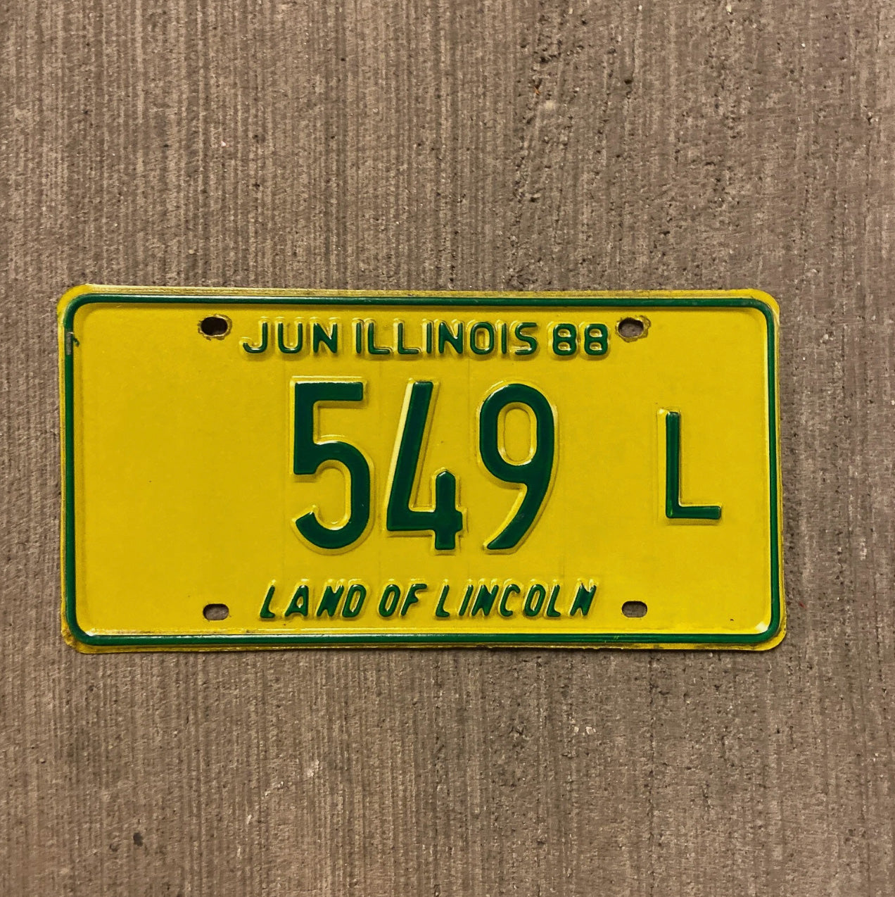 Photo of a 1988 Illinois Truck License Plate Auto Tag Garage Decor Vintage 549 L with original patina