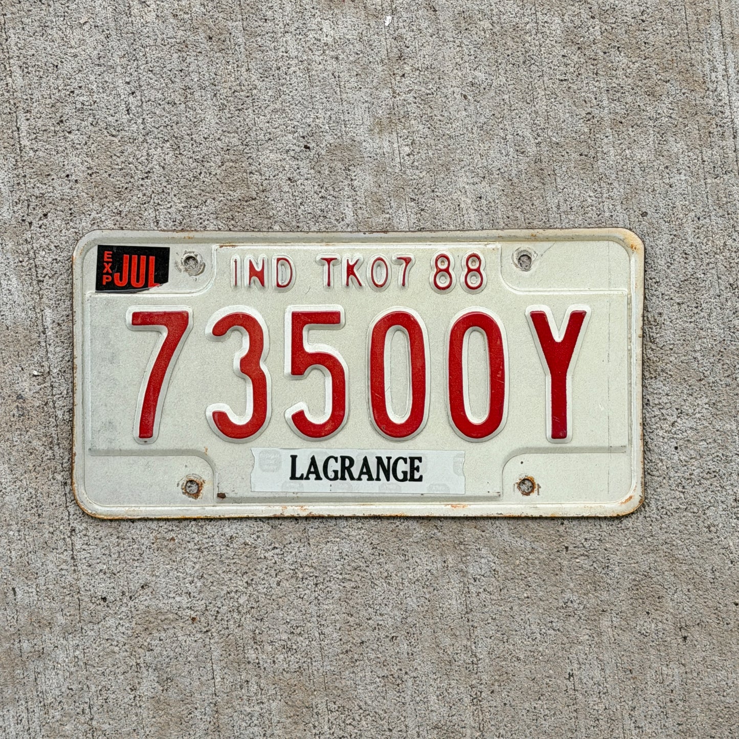 Photo of a 1988 Indiana Truck License Plate Auto Tag Garage Decor Vintage 73500 Y with original patina