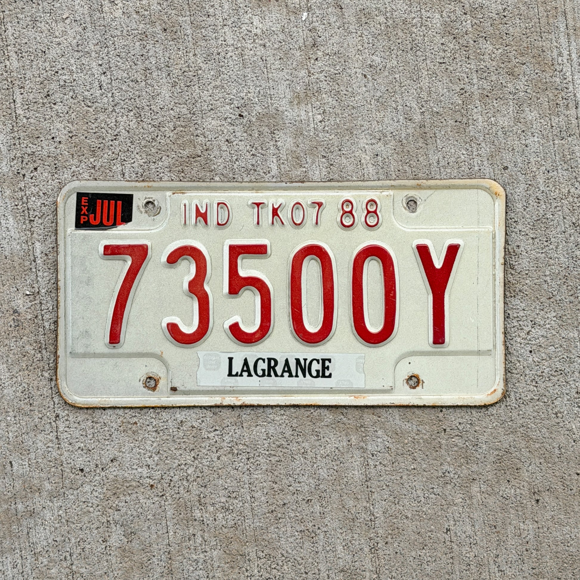 Photo of a 1988 Indiana Truck License Plate Auto Tag Garage Decor Vintage 73500 Y with original patina