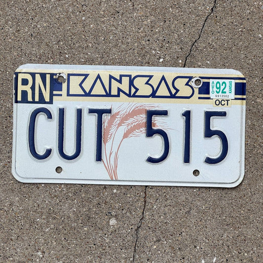 Photo of a 1988 Kansas License Plate Auto Tag Garage Decor Vintage Slice Scissors CUT 515