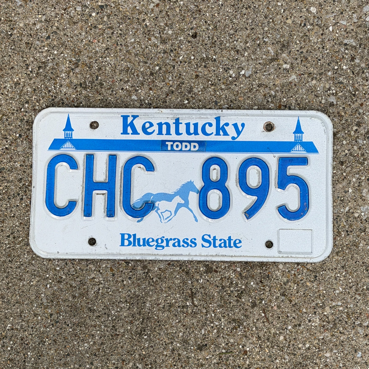 Photo of a 1988 Kentucky License Plate Auto Tag Garage Decor Vintage Churchill Downs Horse Racing CHC 895 with original patina