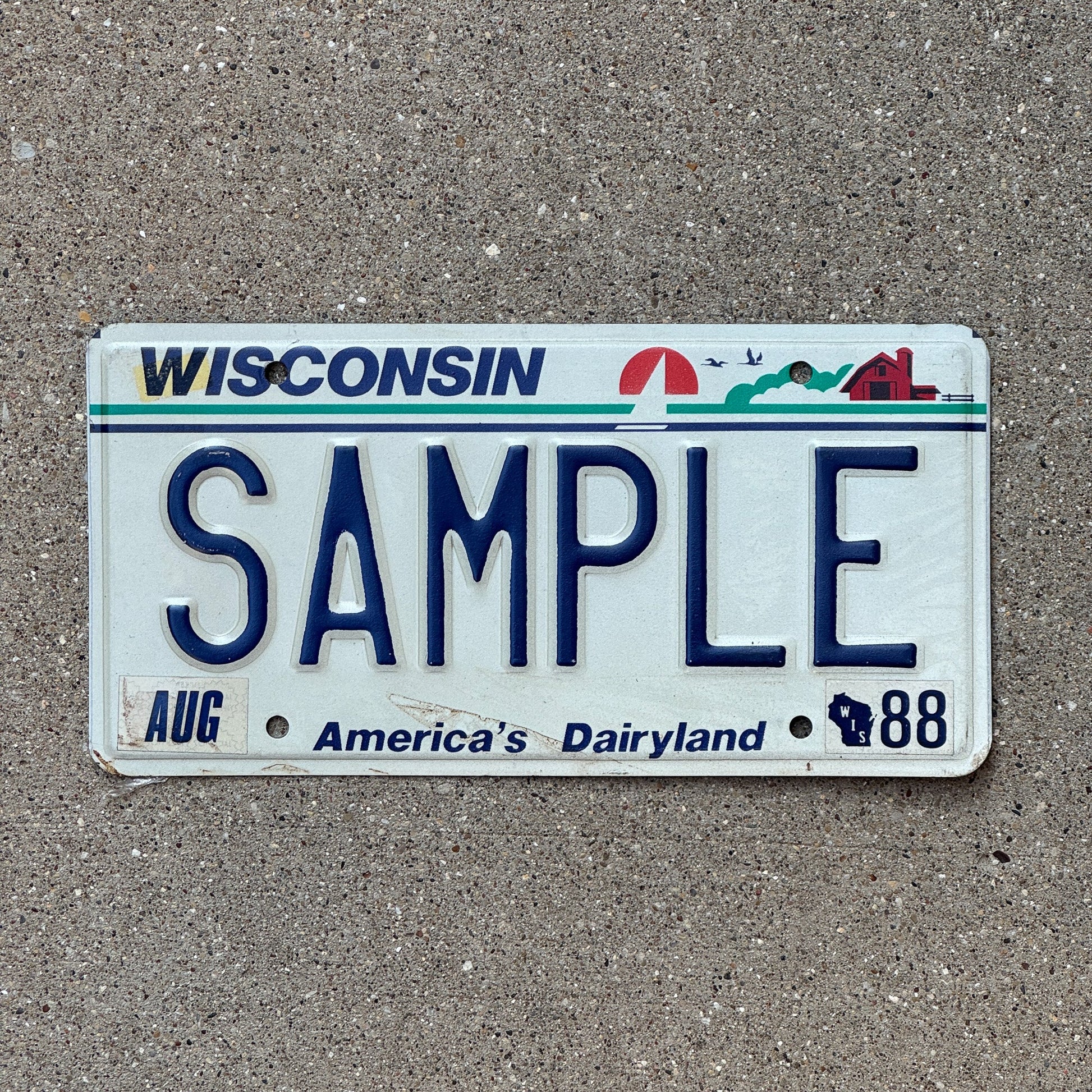 Photo of a 1988 Wisconsin Sample License Plate Auto Tag Garage Decor Vintage SAMPLE