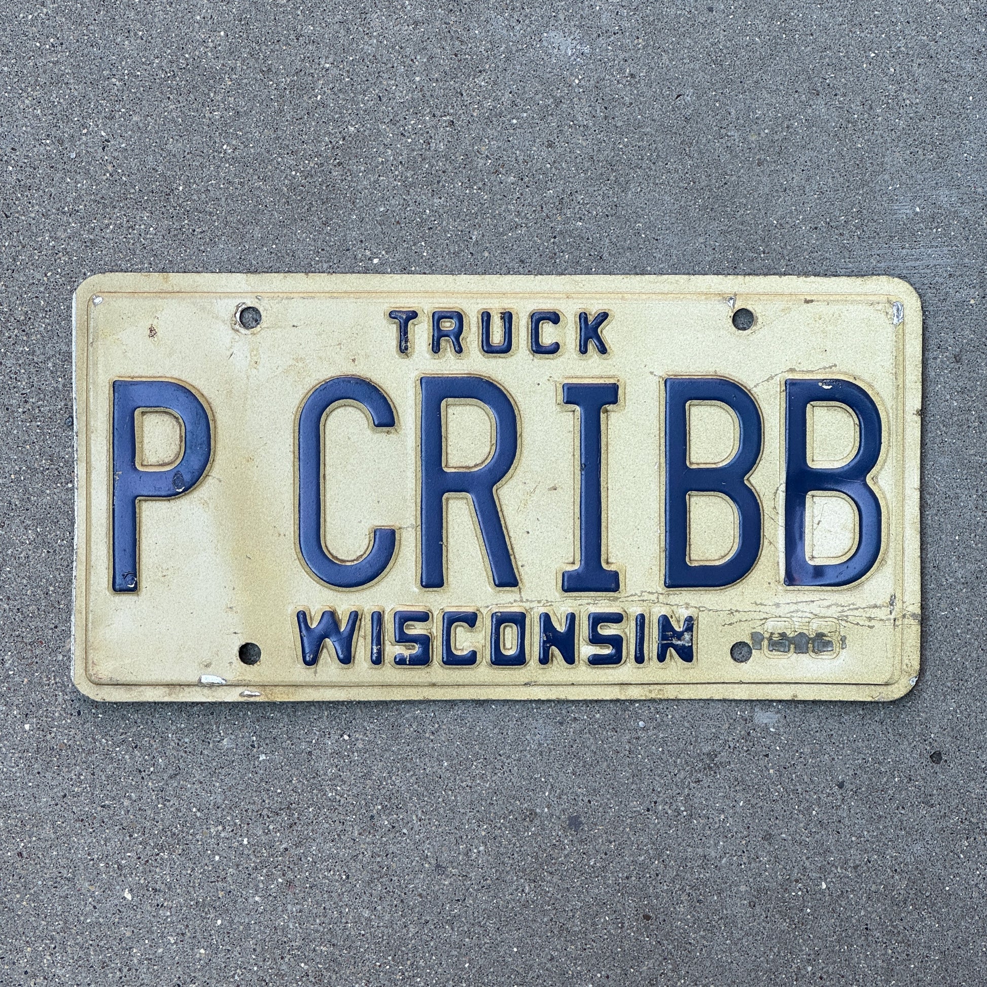 Photo of a 1988 Wisconsin Vanity Truck License Plate Auto Tag Garage Decor Vintage P CRIBB with original patina
