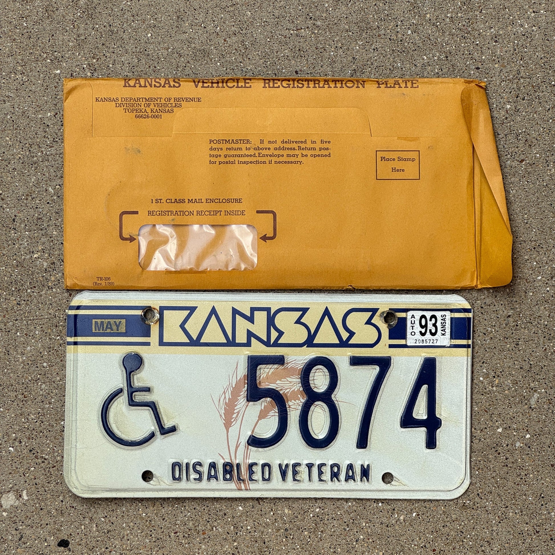 Photo of a 1989 1993 Kansas Disabled Veteran License Plate Auto Tag Garage Decor Vintage With Envelope 5874