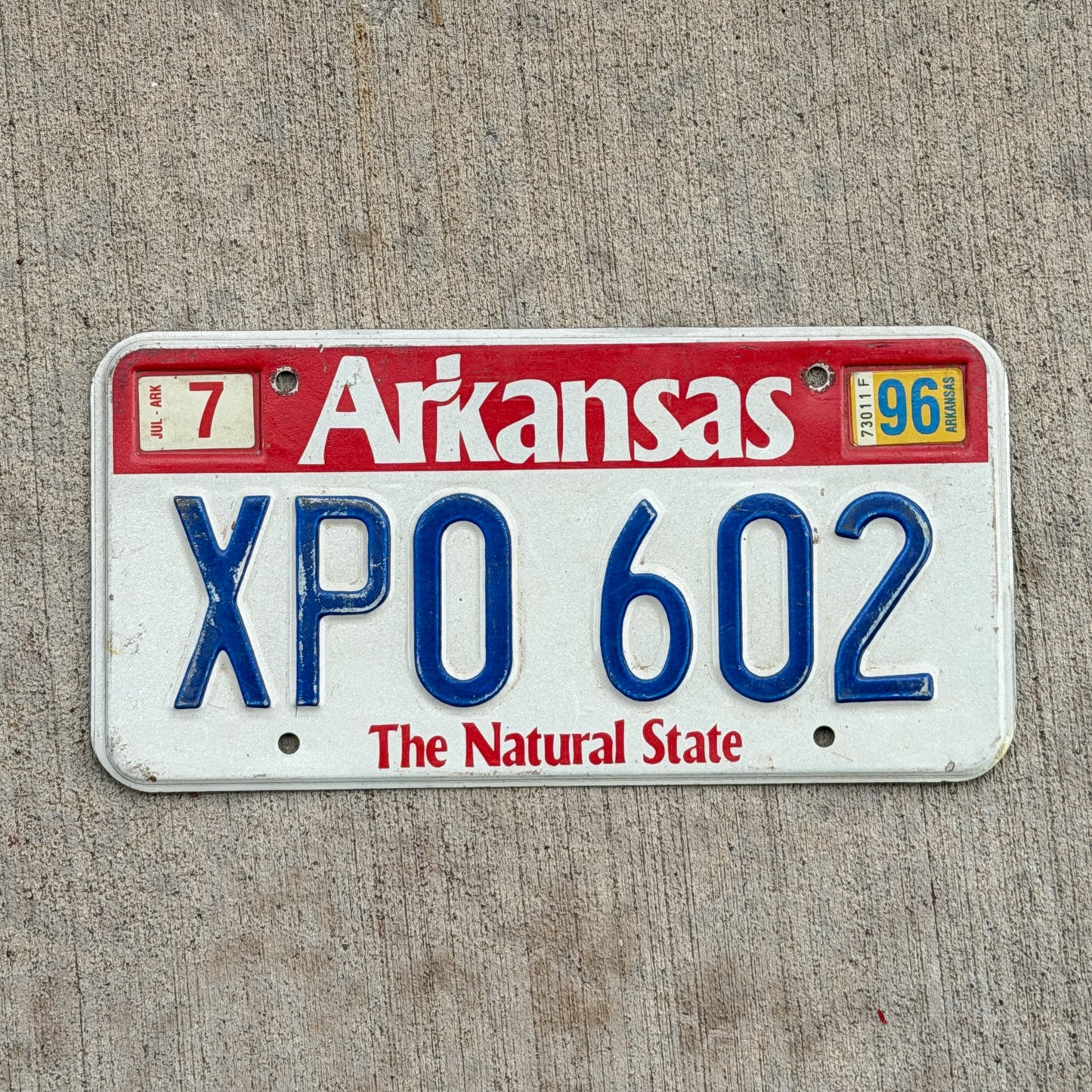 Photo of a 1989 1996 Arkansas License Plate Auto Tag Garage Decor Vintage XPO 602 with original patina
